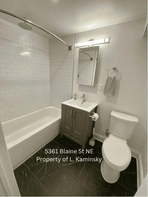 Shower+bathtub with white subway tile - 5361 Blaine St NE