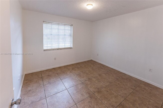 Building Photo - 7553 W 4th Ct