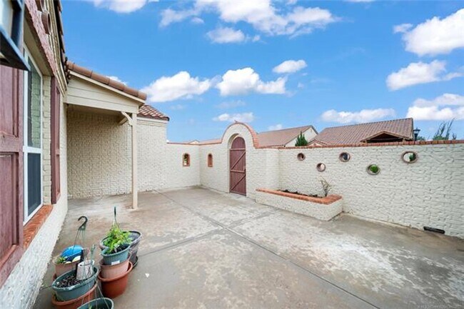Building Photo - Welcome to this inviting Mediterranean-style patio home