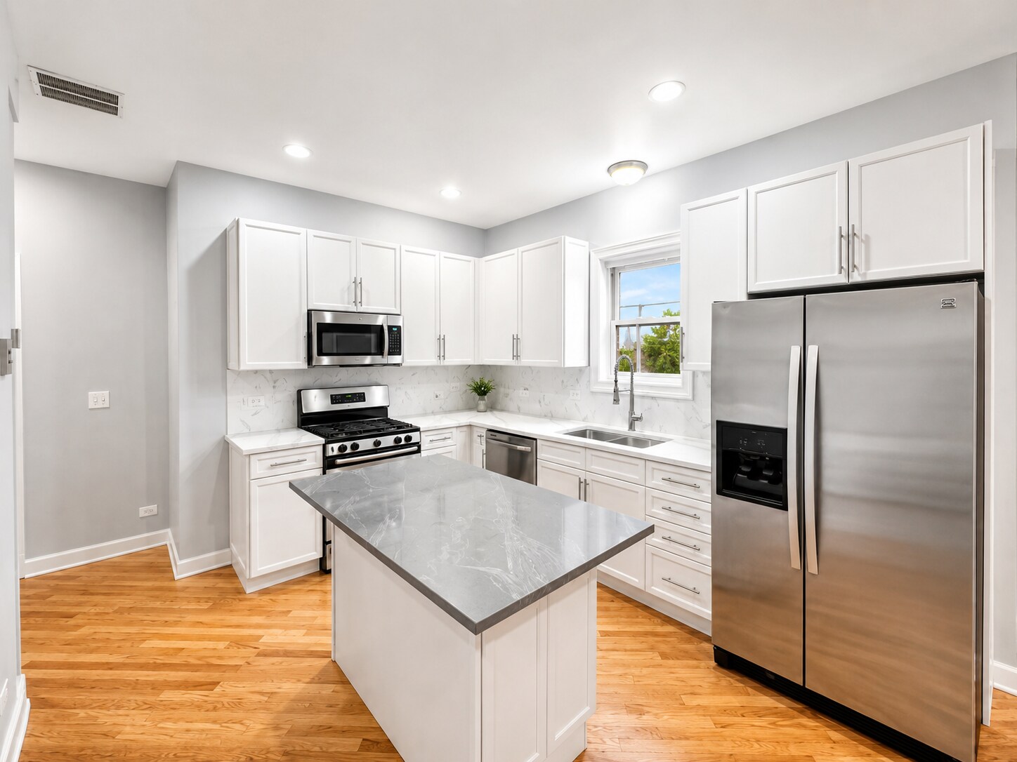 Updated and bright new kitchen with quartz countertops - 3513 North Reta Avenue