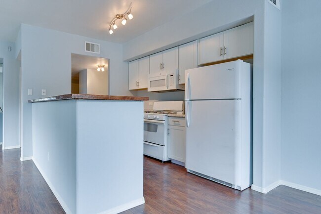 Building Photo - NW!! Gated!!! Clubhouse!!!Community Pool!!! 1st Floor Condo!!! Wood like floors!! No Carpet!!