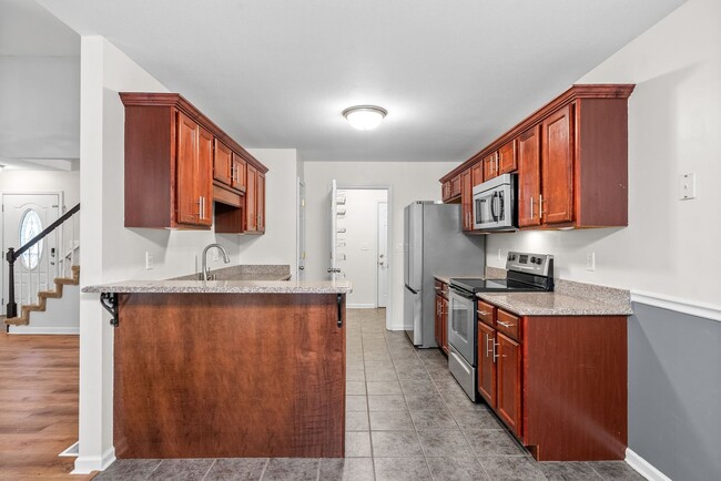 Building Photo - Pet Friendly Three Bedroom with Bonus!