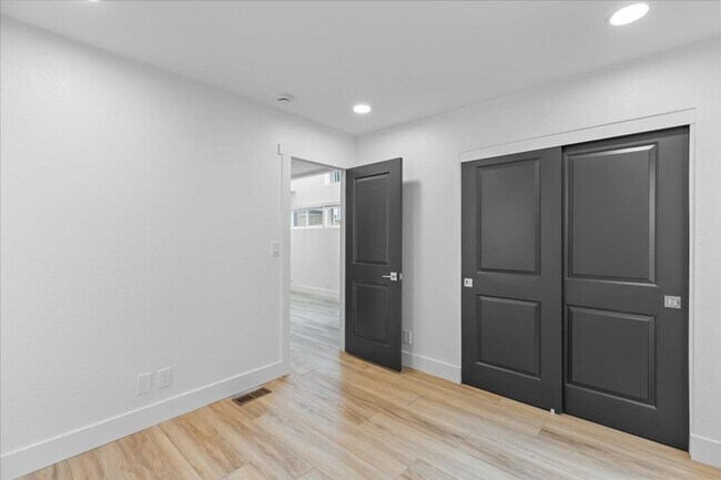 Building Photo - COMPLETELY REMODELED, BRIGHT & AIRY, TRI-LEVEL HOME W/ TOP-FLOOR GREAT ROOM LIVING SPACE, 2-CAR G...