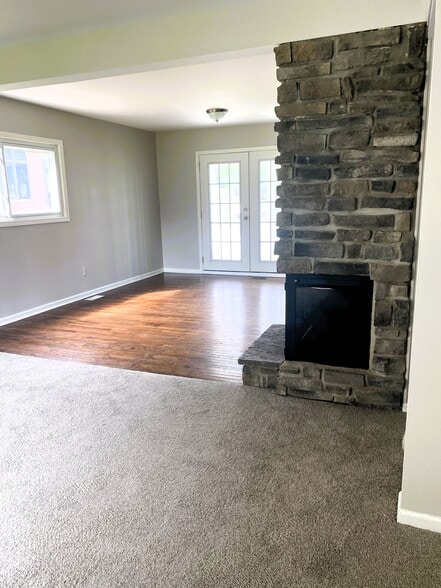 Hardwood floors and fireplace. - 1611 Ludean Dr