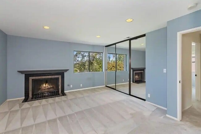 Building Photo - Upgraded La Costa Townhome