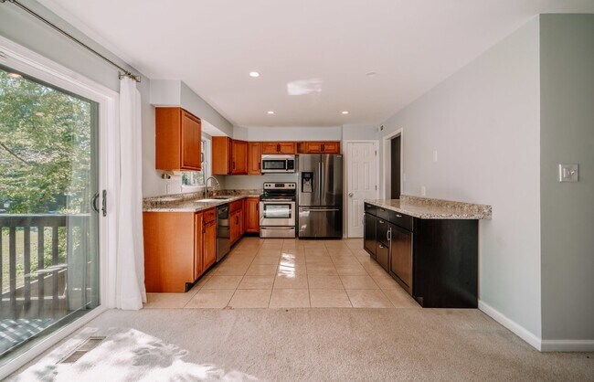Building Photo - Spacious 5-Bedroom End-Unit Townhome in Reston with 3 Finished Levels, Renovated Kitchen & Fenced...