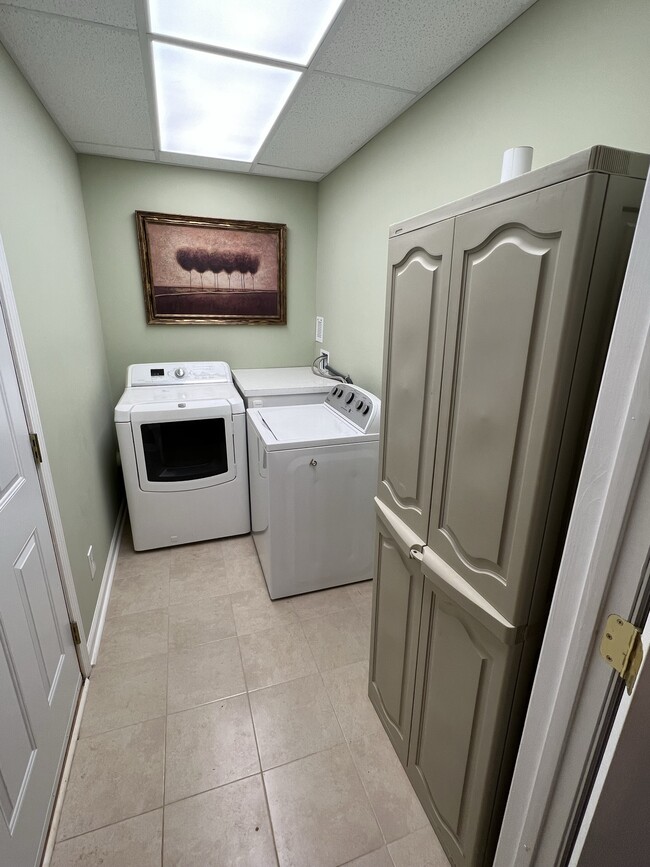 Laundry room with storage. - 3617 Sunset Rdg