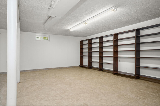 Finished basement with many built-ins. - 319 Davenport Ave