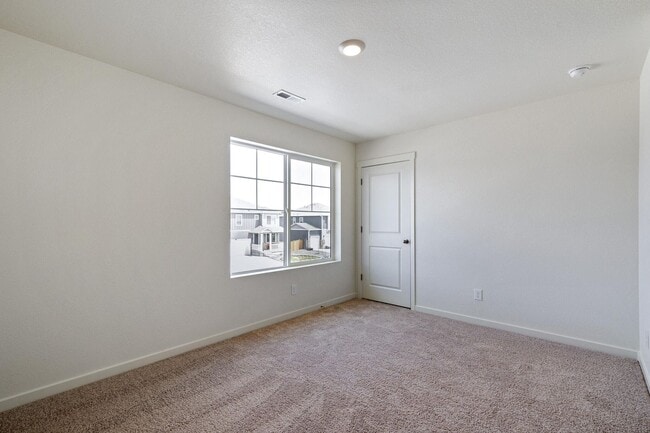 Building Photo - Spacious 4-Bedroom Wellington Home with 3-Car Garage, Loft & Fenced Backyard!