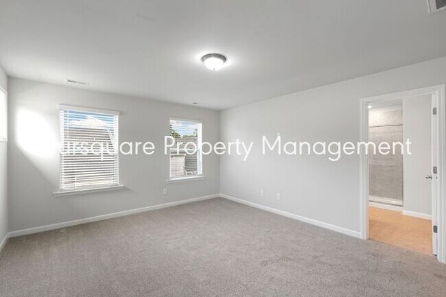 Building Photo - Bright 3-Bed 2.5-Bath End-Unit Townhome with Washer/ Dryer, Granite Kitchen & 2-Car Garage.Conven...