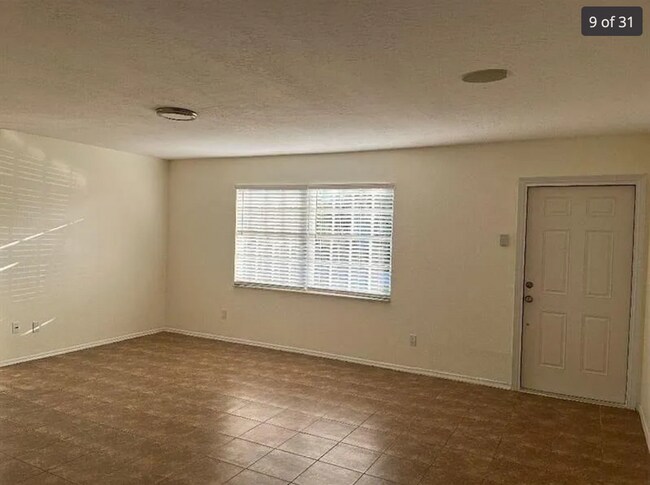 Building Photo - 2/2/1 home with a spacious fenced backyard...