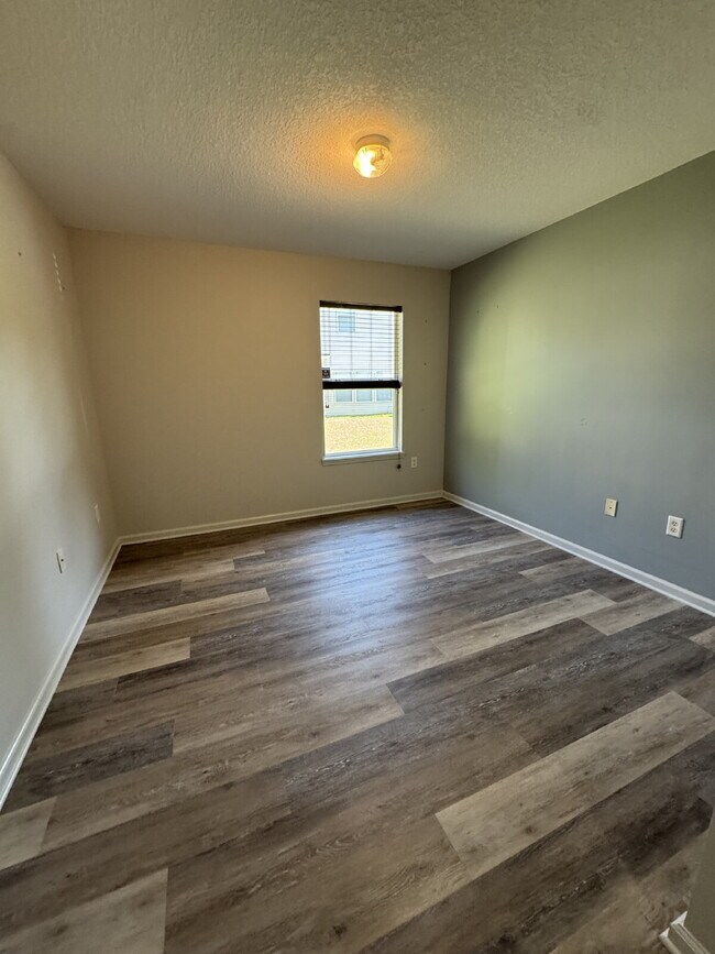 Building Photo - Spacious 4 Bedroom Pond-View Home with Upg...