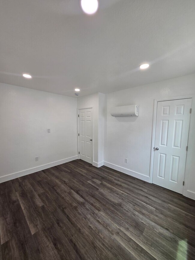 Building Photo - New paint and flooring throughout.