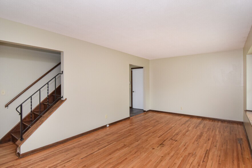 Living Room with hardwood floors and open staircase - 11420 Terrace Rd NE