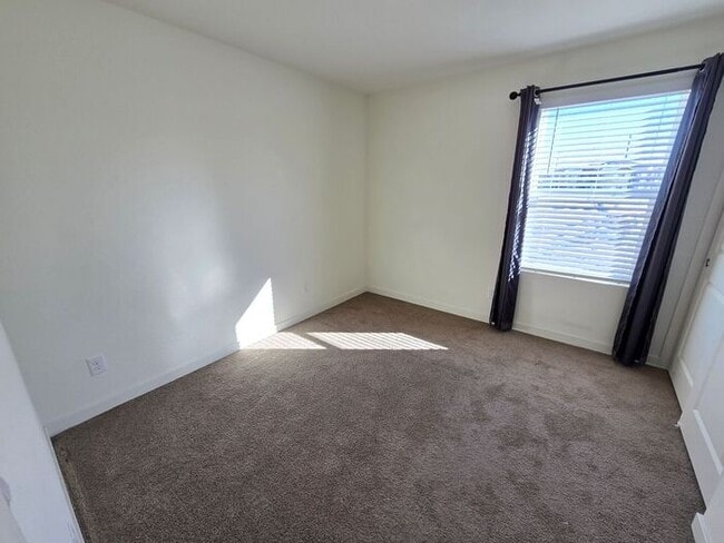 Building Photo - Modern 3-Bedroom Townhome with 2-Car Garage, Bright Interiors & Private Patio