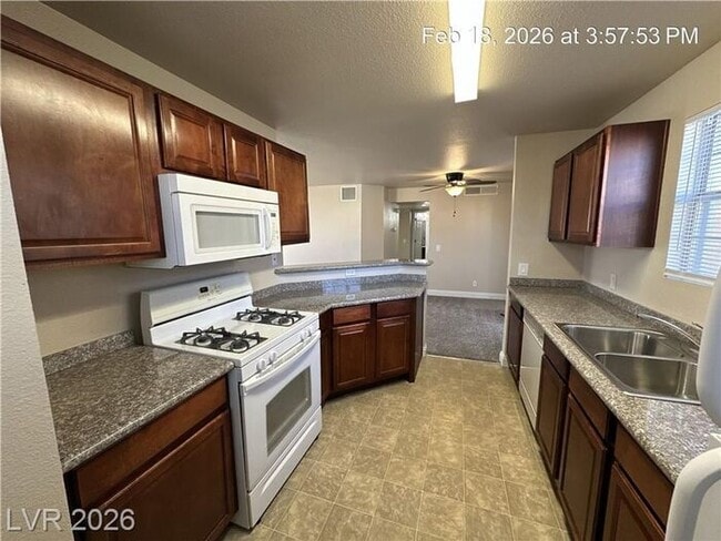 Building Photo - Bright Northwest Second-Floor Condo with Oversized Balcony & Community Pool!