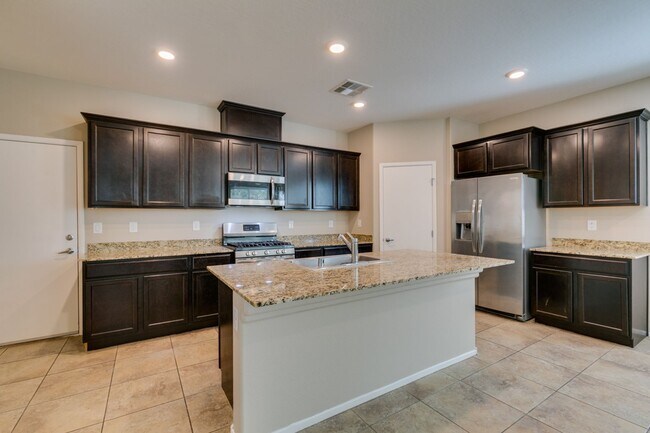 Building Photo - Spacious Townhouse with Loft & Rare 3-Car Garage!