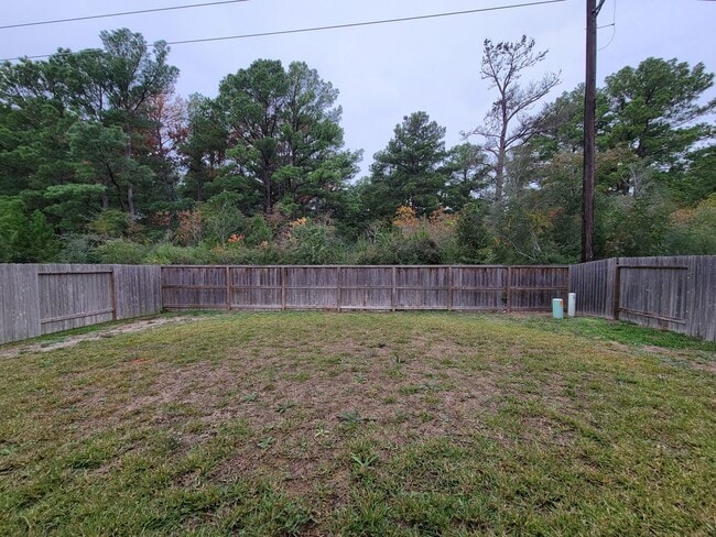 Building Photo - BEAUTIFUL 3 BEDROOM 2 BATH HOME WITH NO BACKYARD NEIGHBORS. TALL TREES AS YOU LOOK FROM THE COVER...