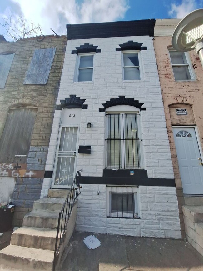 Building Photo - Historic Charm Meets Modern Comfort: 2BR Baltimore Townhouse with Private Yard