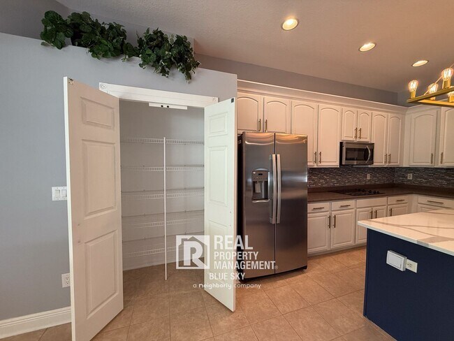Building Photo - Executive Home with Custom Finishes in Gat...