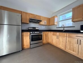 Building Photo - 210-10 56th Ave