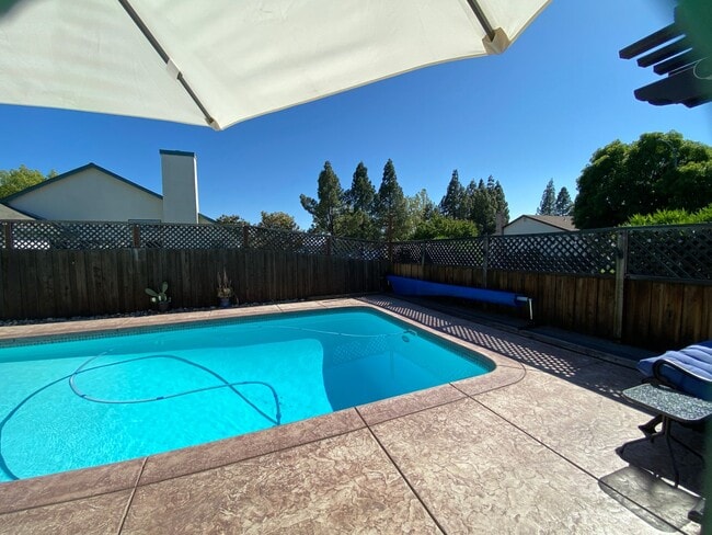 Building Photo - Stunning Home with Backyard Oasis with inground pool and spa