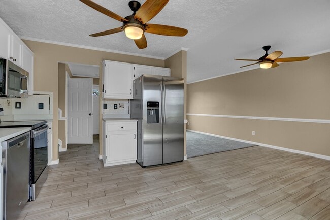 Building Photo - Spacious 4-Level Home with Deck, Workshop ...