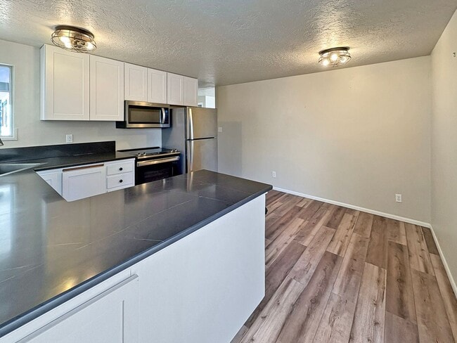 Building Photo - 3-Bedroom Boise Home with Outdoor Fireplace, Fenced Yard & LVP Flooring Near Downtown | $500 Off ...