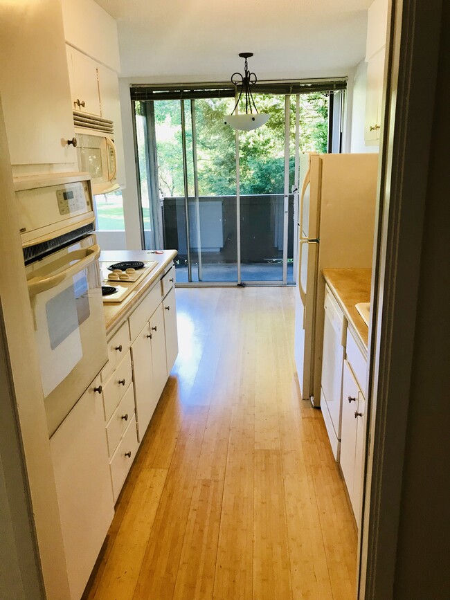 Kitchen opens into dining area - 5343 Broadway Ter