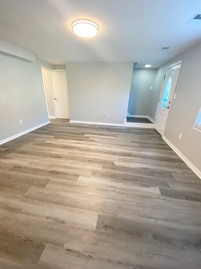 Open floor plan- living and dining area - 1861 Village Green Dr
