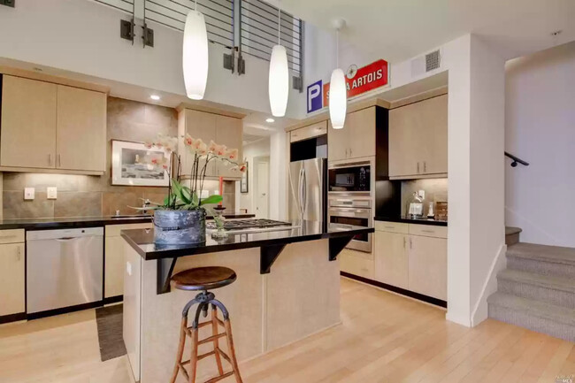 Modern kitchen island with high-end stove. - 113 F St