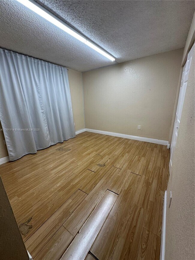 Building Photo - 6095 W 19th Ave