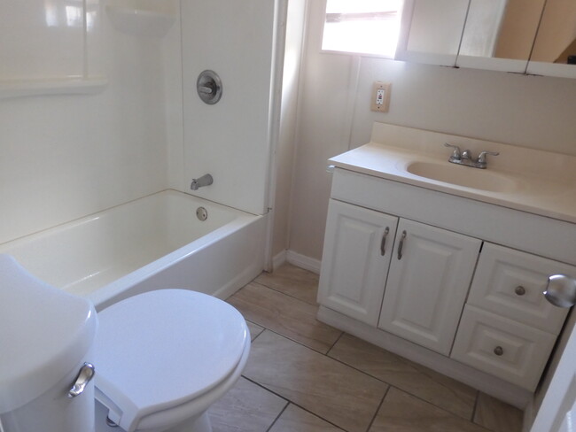 NEW BATHROOM - TILE FLOOR - 6710 Ballad Ln