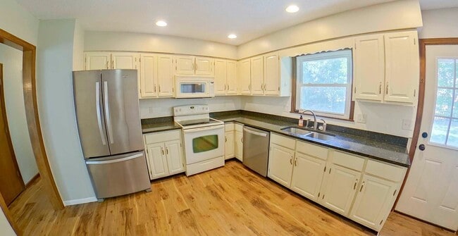 Building Photo - Double Patios + HUGE Fenced-In-Yard + Two-...