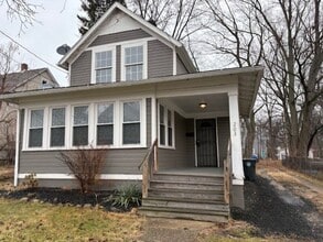 Building Photo - Classic Akron Home, Modern Convenience: Deck, First Floor Bedroom & Laundry and 2 Sunroom's