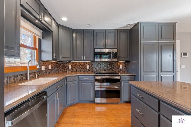 Building Photo - Available now! Spacious 3 Bed, 3 Bath Home with Modern Open Layout & Lawn Care Included