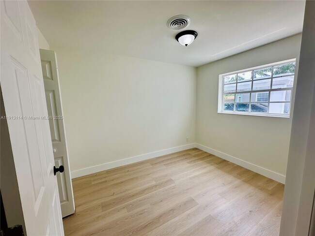 Building Photo - 6570 NW 6th Ct