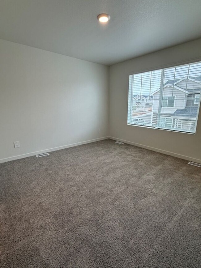 Building Photo - New 2 Bedroom Townhome + 2 Car Garage