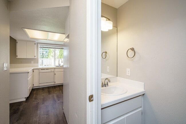 Building Photo - Recently Updated with Wood Laminate Flooring and Fresh Paint