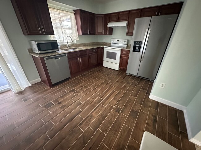 Building Photo - Unique Find! HUGE detached garage/workshop, 3 bedroom, 1 1/2 bath home, screened porch