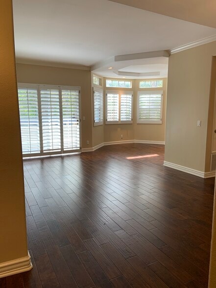Real hardwood floors throughout unit - 14415 Benefit St