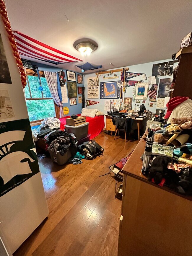 Building Photo - Dream Home in Highland, Michigan: Your Private Oasis on 5 Wooded Acres