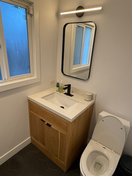 en-suite bathroom vanity - 5208 Woodman Ave