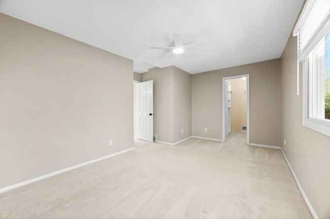 Primary bedroom with walk-in closet - 17800 Frommes Cir