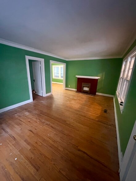 Living room (non-functional fireplace) - 3904 Charlotte St