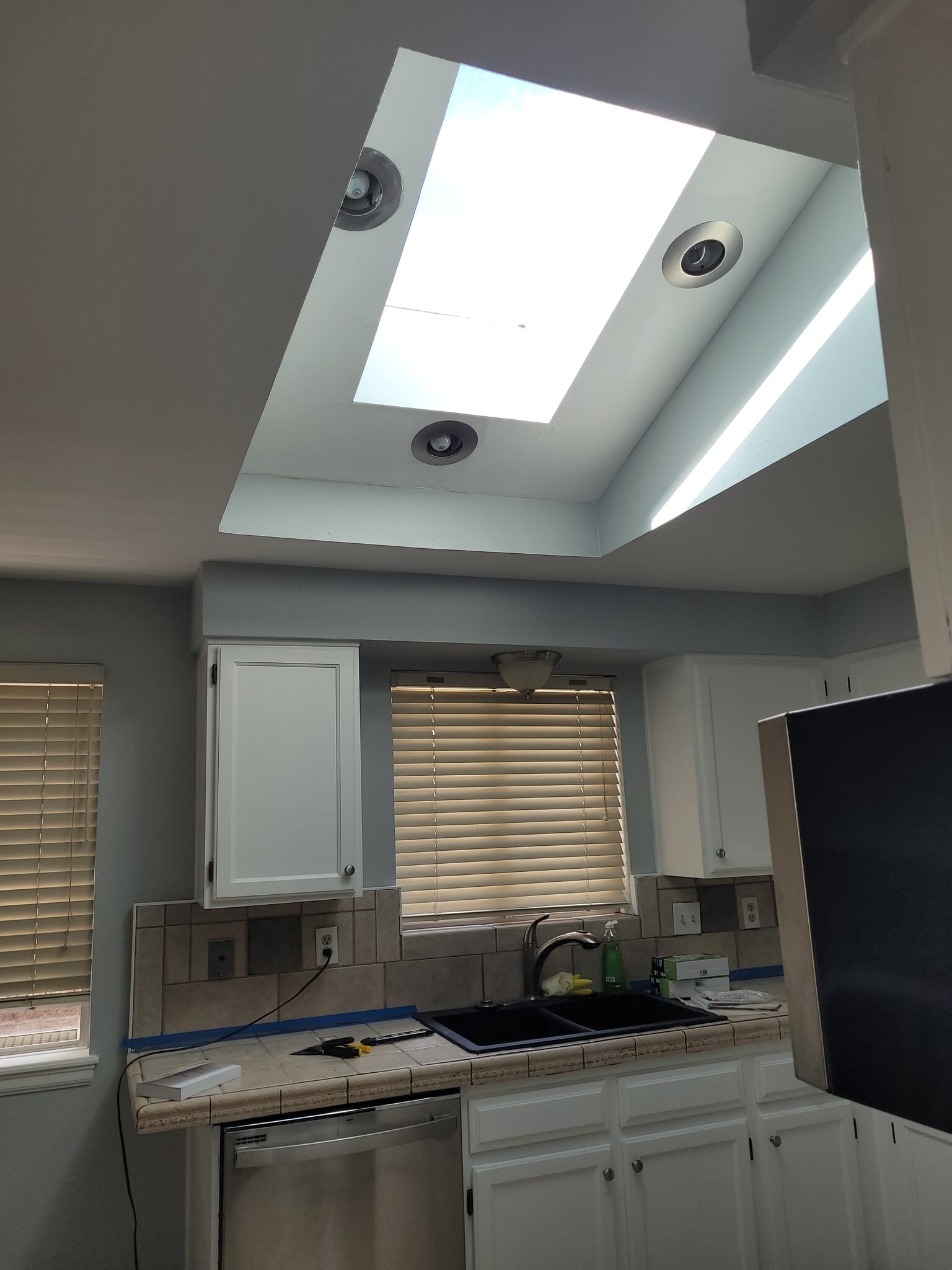 Skylight in Kitchen - notice the ceiling lights - 18863 east milan