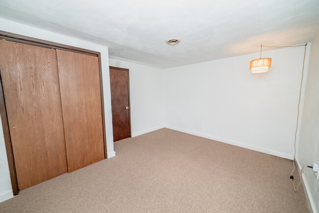 Bedroom with new windows and carpeting - 22 Muckey Rd