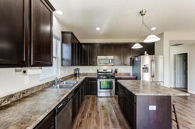 Building Photo - 6995 Hearthwood Dr