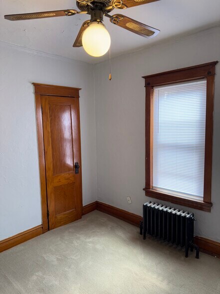 Large bedroom with brand new carpet, hardwood accents and large closet space. - 2346 122nd St