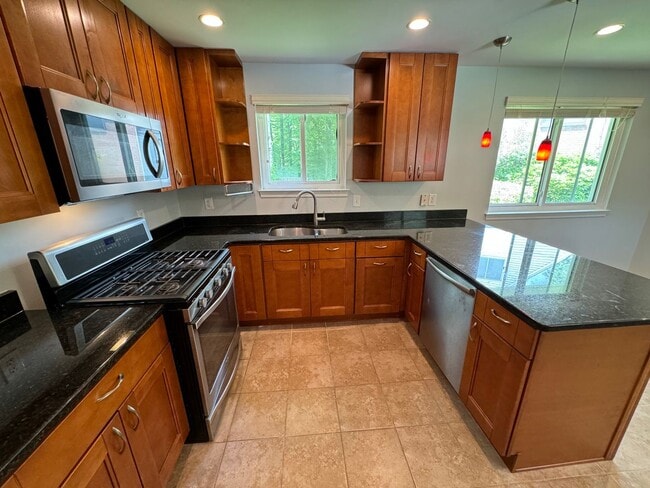 Building Photo - Sought-After 4 Bed 3 Bath L-Shaped Rambler...